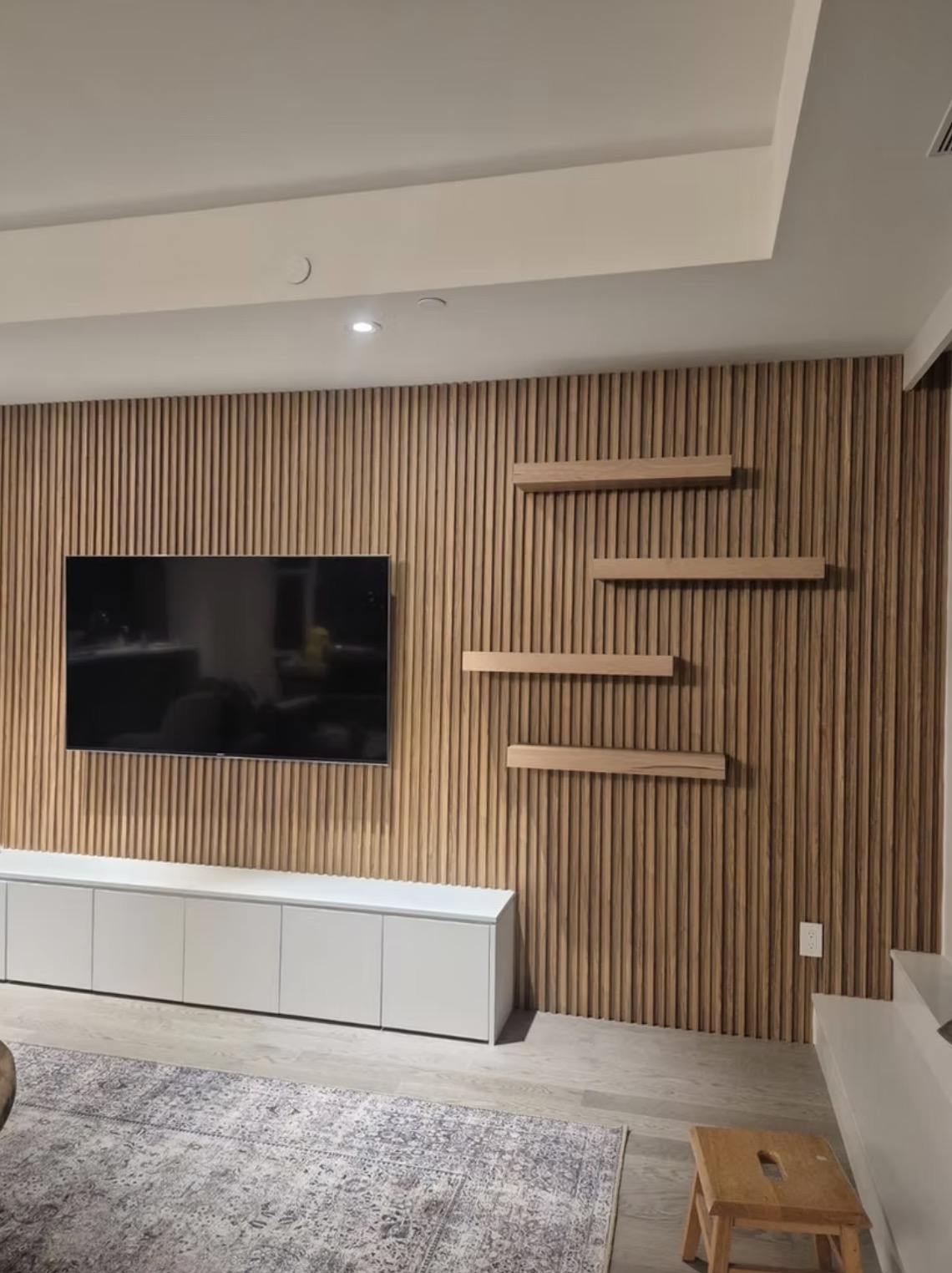 Modern living room with a wood slat accent wall, — European window and door project, Vireo Homes GTA