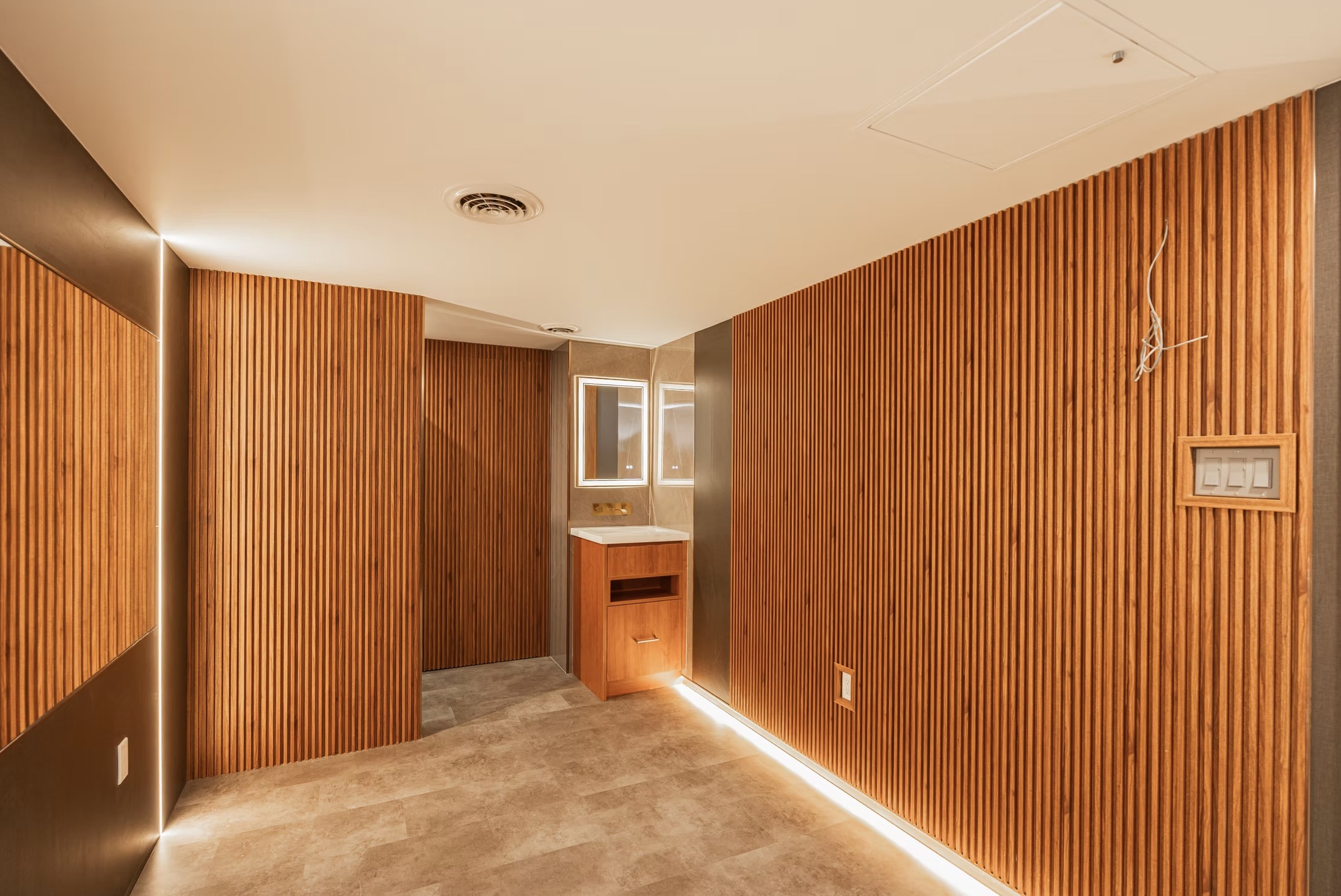 Room with light brown vertical slatted wood walls, — European window and door project, Vireo Homes GTA
