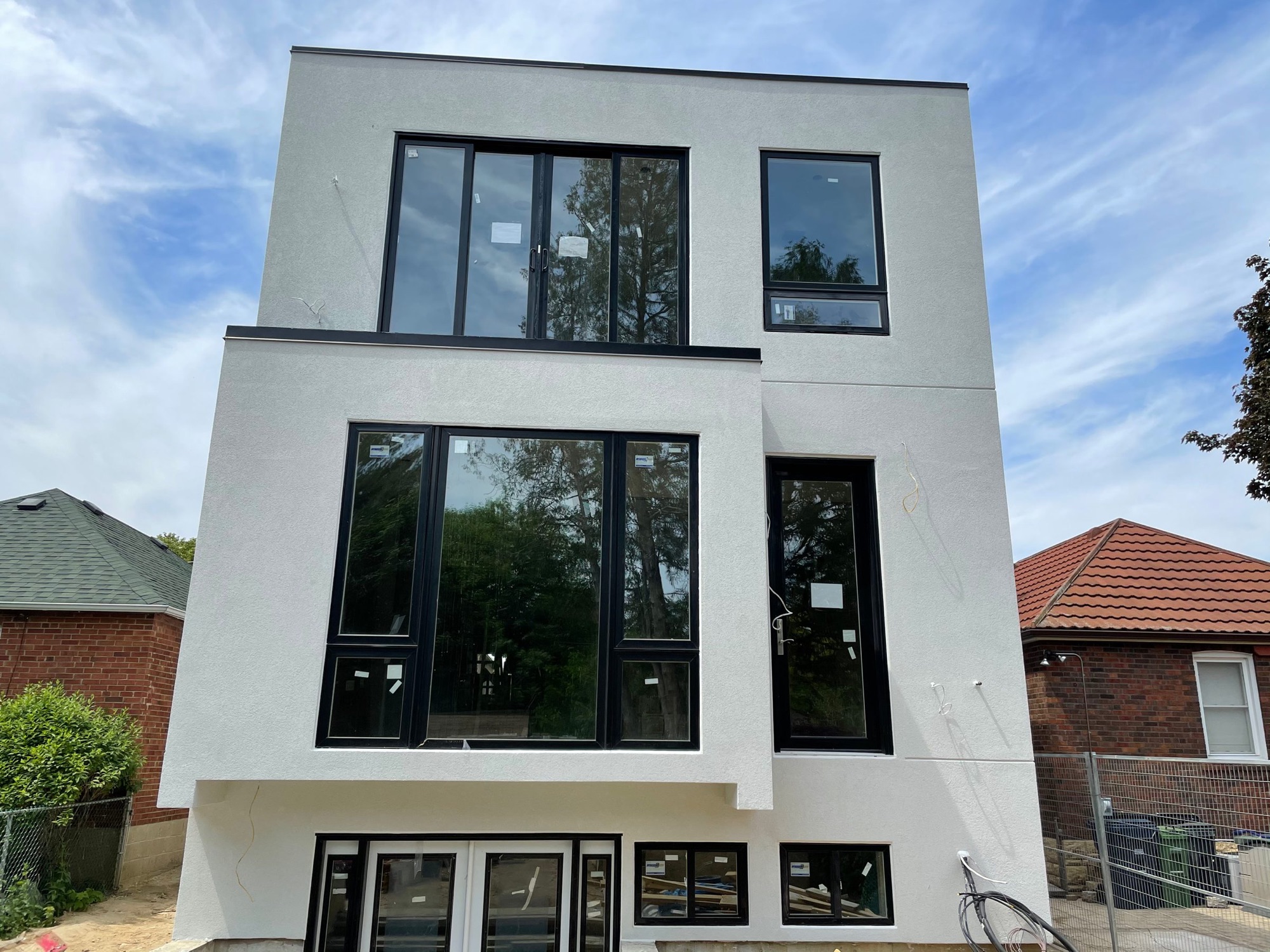 Exterior of a modern two-story white house with many — European window and door project, Vireo Homes GTA